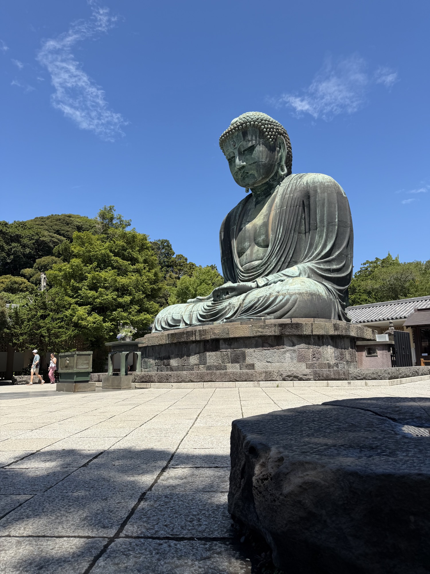 The Great Buddha of Kamakura at Kōtoku-in Temple under a blue sky
